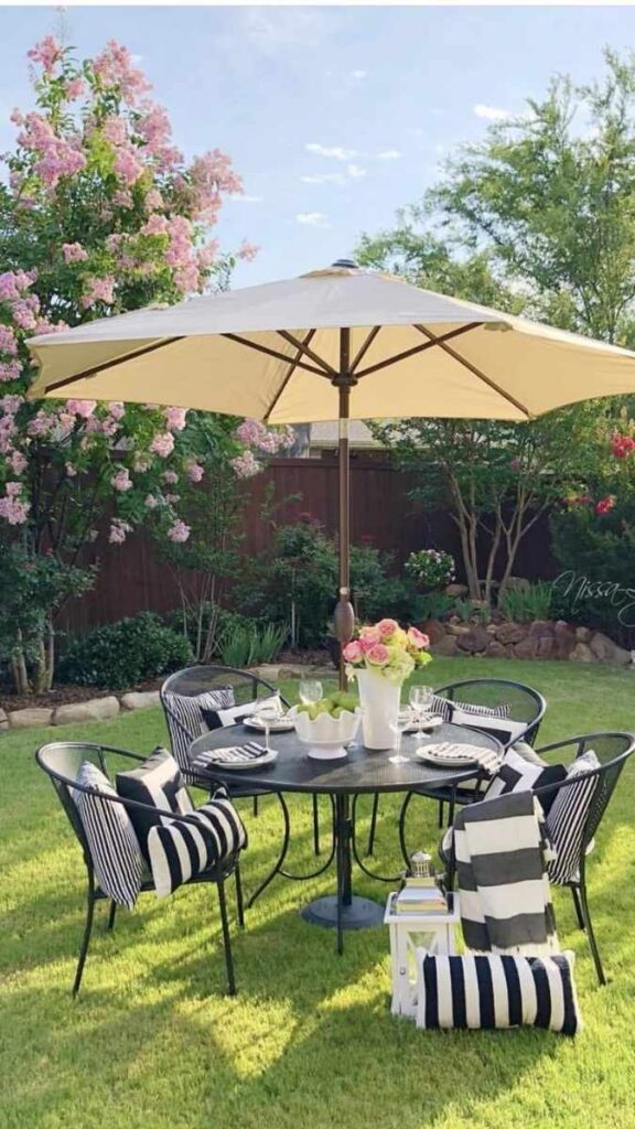 A Water Play Table Set Into a Shaded Pergola Corner