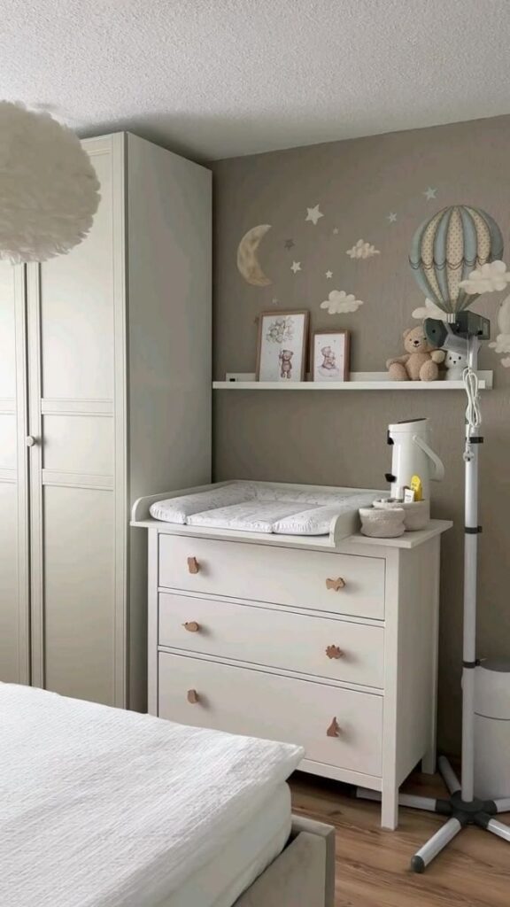 28 Small Nursery Setup Ideas That Actually Work in Tight Spaces 10 A Wall-Mounted Baby Monitor Bracket to Clear the Dresser Top