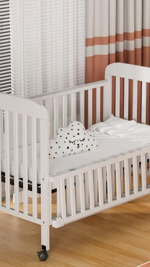 28 Small Nursery Setup Ideas That Actually Work in Tight Spaces 6 Under-Crib Storage With Flat Rolling Bins